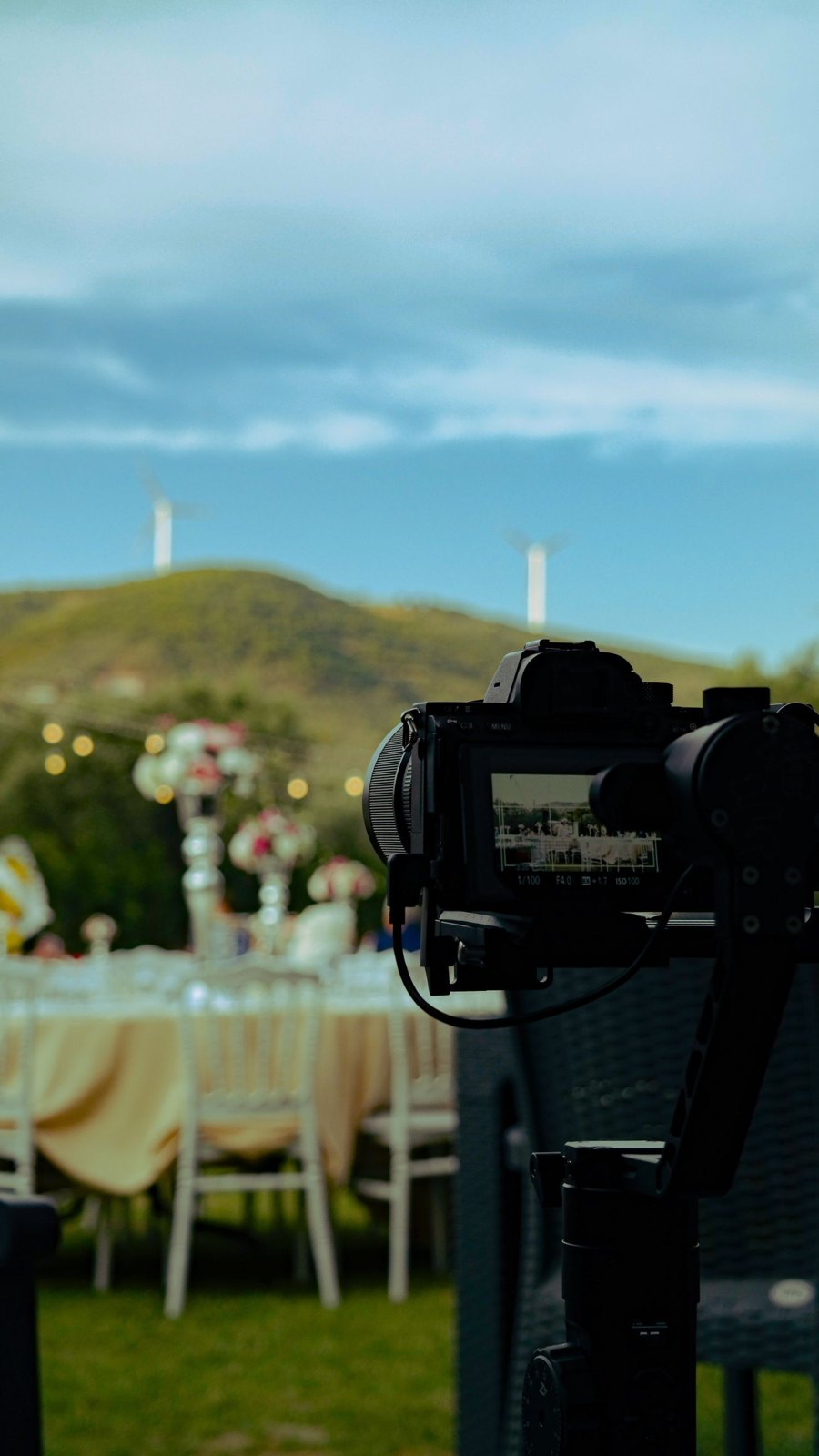 A camera recording details of a prepared event table.